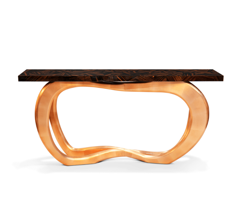 Console made from wood with a top made through ebony leaf. Its base is lined with copper leaf.