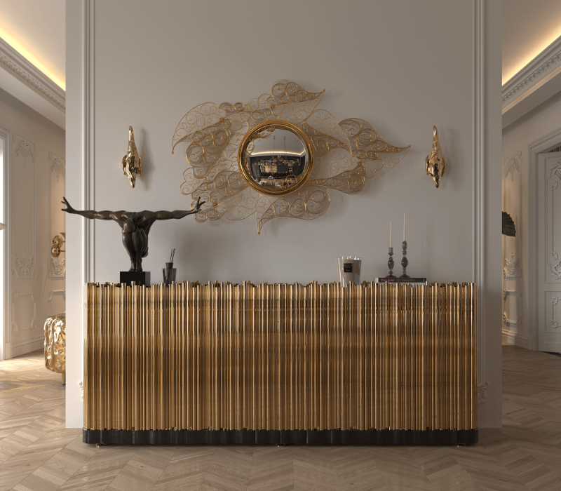 gold modern sideboard with golden details in a entryway