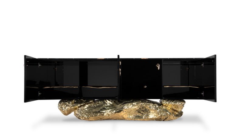a open black sideboard with golden foot